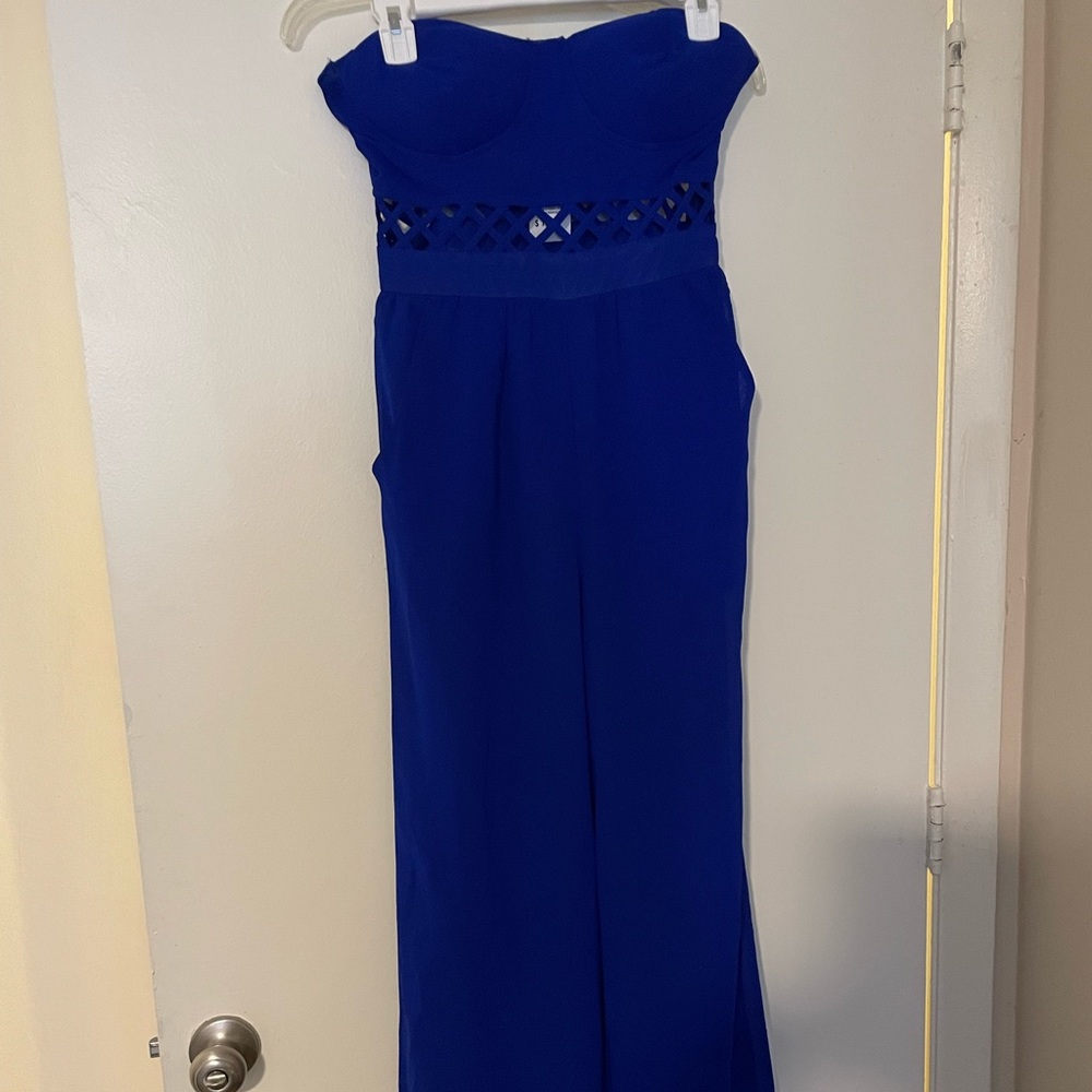 Adorable bright blue romper from Charlotte Russe. Size small.